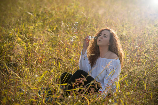istock Beautiful girl makes bubbles 867046618