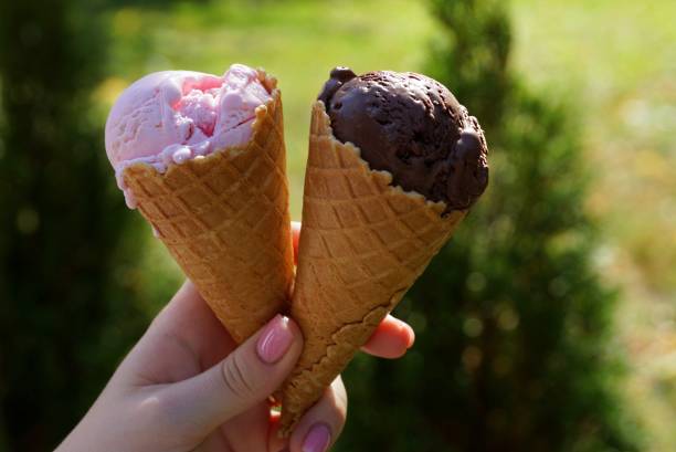 istock Two frozen in a hand outdoors on a sunny summer day 867047360