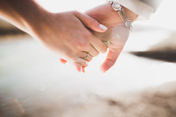 istock Wedding couple bride and groom holding hands 867056094