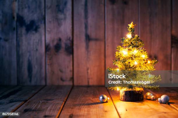 Christmas Tree And Ornaments On Old Wood Stock Photo - Download Image Now - Christmas, Christmas Tree, Table