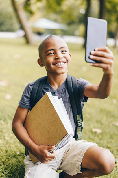 istock little kid ready to go school using the phone 867060830