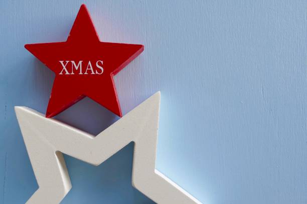istock Red wooden christmas star on blue background 867061570