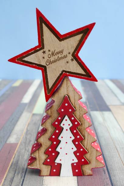 istock Red wooden christmas star on blue background 867061732