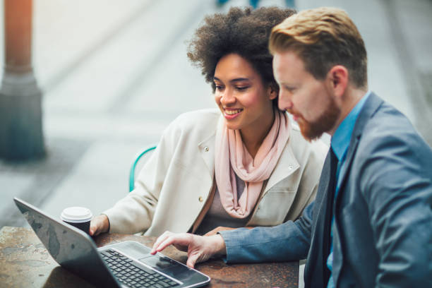 istock Business people using laptop outdoor. 867062052