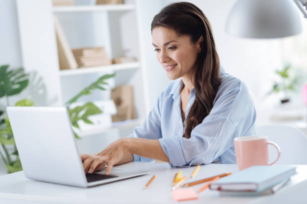 istock Positive attractive woman using a laptop 867062106