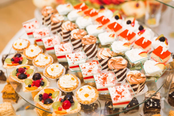 istock Delicious sweets on wedding candy buffet with desserts, cupcakes 867062200
