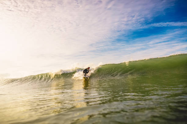 istock Surfer on surfboard ride at wave. Winter surfing 867068622