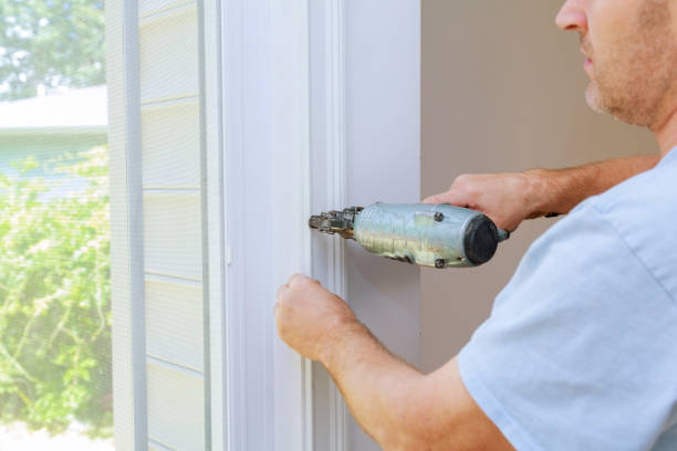 istock Carpenter using a brad nail gun to complete framing trim Air gun for nailing 867074482
