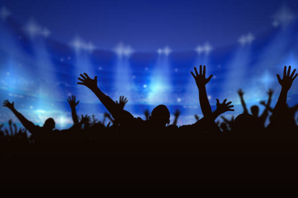 Silhouette Crowd people enjoying the concert, happy people jumping, a large group celebrating new year holiday, party background fun concept. stock photo