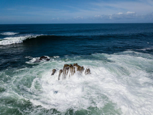 istock Aerial View of Waves Crashing on Rocks 867081734
