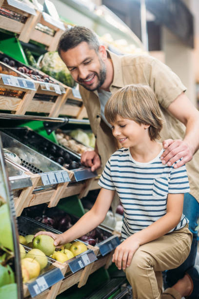 istock father with son in supermarket 867083444