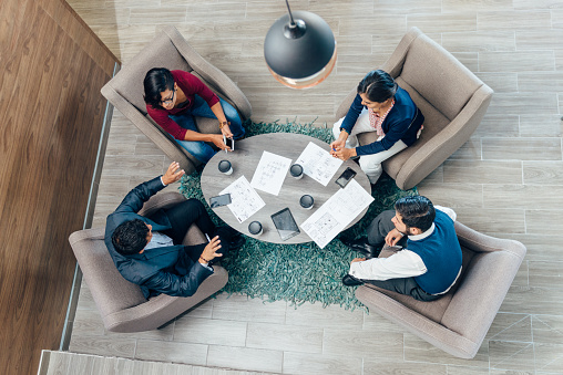 Overhead view of a business meeting in office space