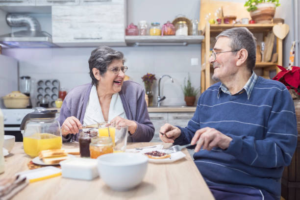 istock Cheerful senior couple having breakfast 867093328