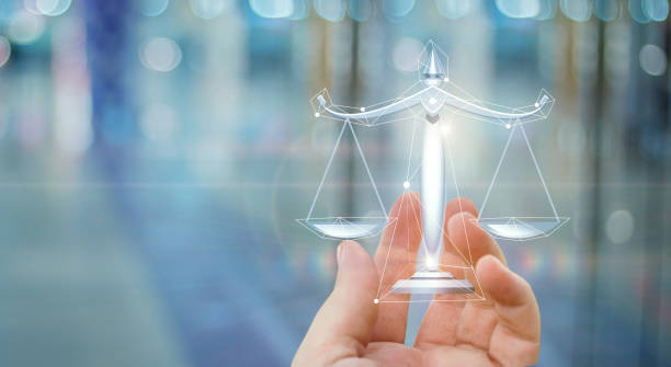 istock Scales of justice in hand . 867093830