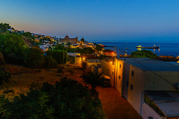 At night Salina with Church Santa Marina in the backgroung, aeolian islands, Sicily At night Salina with Church Santa Marina in the backgroung, aeolian islands, Sicily salina sicily stock pictures, royalty-free photos & images