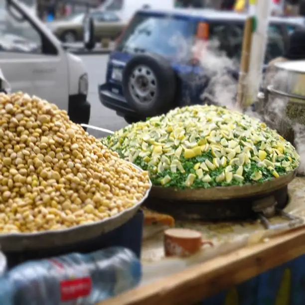 A small truck food in one of hometown in Jordan which sell hot corn.