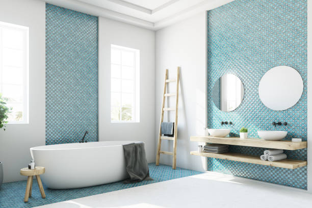 istock Blue and white bathroom, white tub side 867119980
