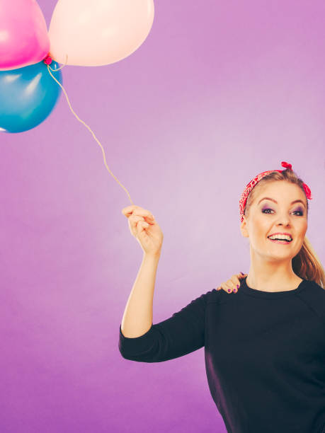 istock Smiling crazy girl having fun with balloons. 867120152
