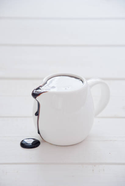 istock Dark chocolate sauce in a white gravy boat 867120482
