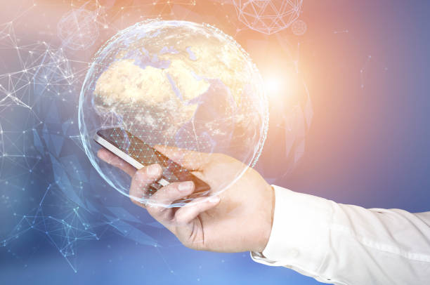 istock Businessman s hand with a smartphone, planet 867124470