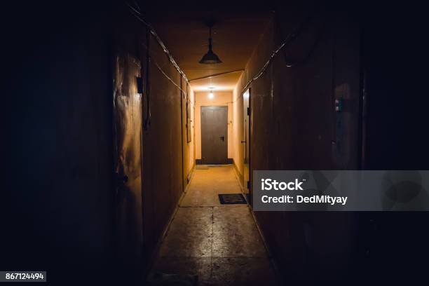 Dirty Empty Dark Corridor In Apartment Building Doors Lighting Lamps Stock Photo - Download Image Now