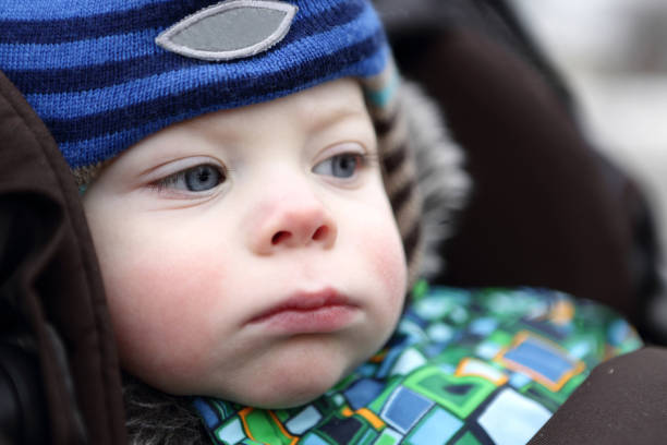 istock Pensive toddler in stroller 867127602