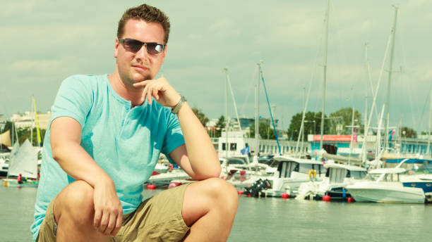 istock Man walking on marina during summer 867127948