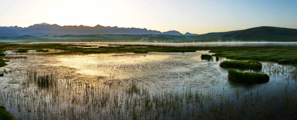 istock Panoramic landscape with sunrise over a lake 867129700