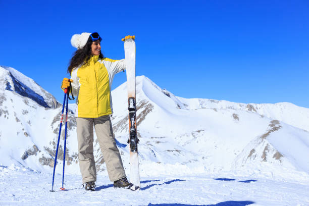 istock Female Skier on top of mountain 867133030