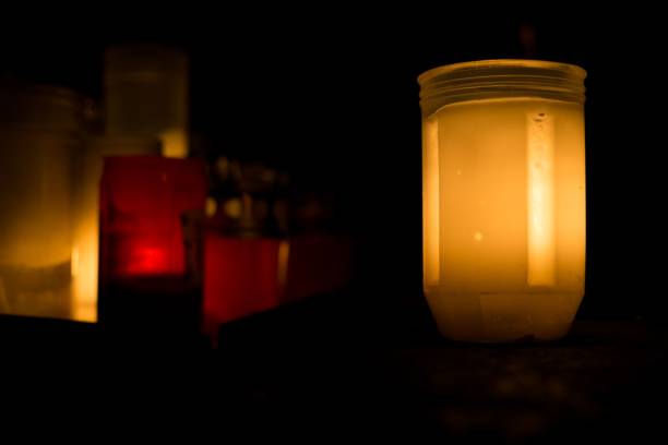 istock Candles on the Cemetery for All Saints at night. 867133502