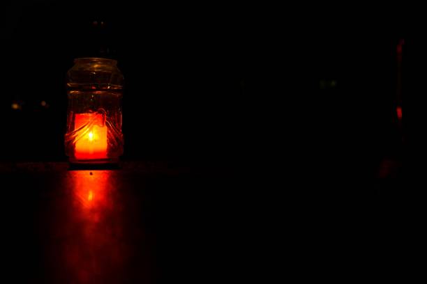 istock Candles on the Cemetery for All Saints at night. 867133538