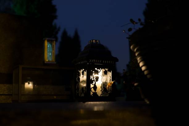 istock Candles on the Cemetery for All Saints at night. 867133558