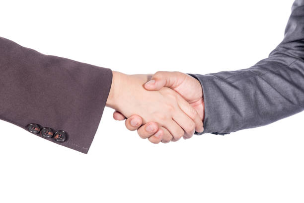 istock business man and women shaking hand 867133894