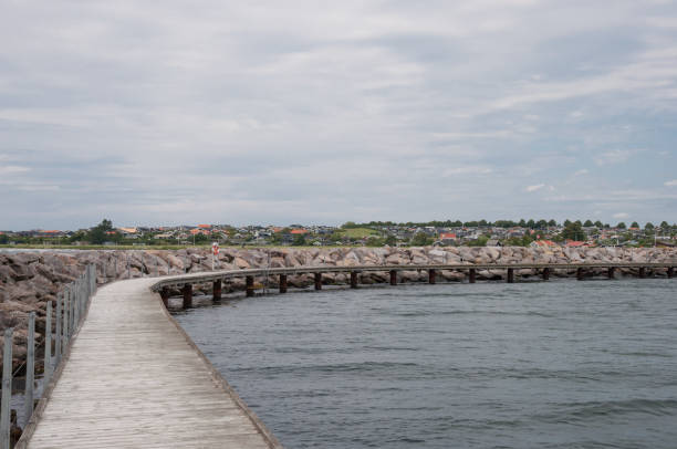 istock Walking platform along a breakwAter in Danish vacation town of Karrebaeksminde 867141988