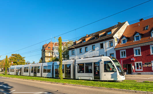 Freiburg im Breisgau, Germany - October 14, 2017: CAF Urbos 100 tram in the city center. The Freiburg tram network consists of 5 lines with 73 stops.