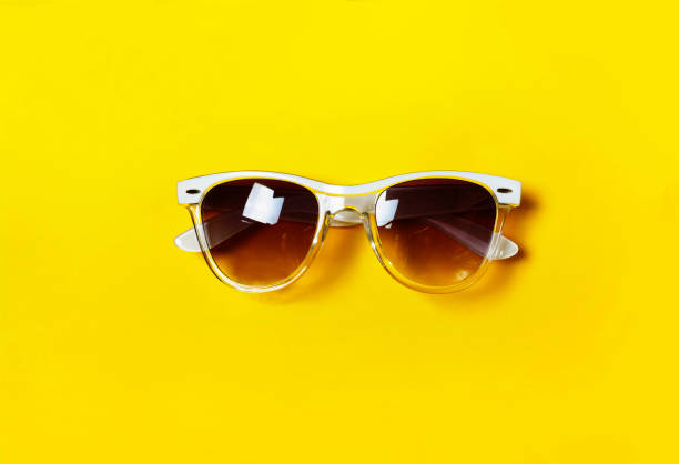istock Hipster glasses.The concept of minimalism. White frame. Yellow background. 867143122