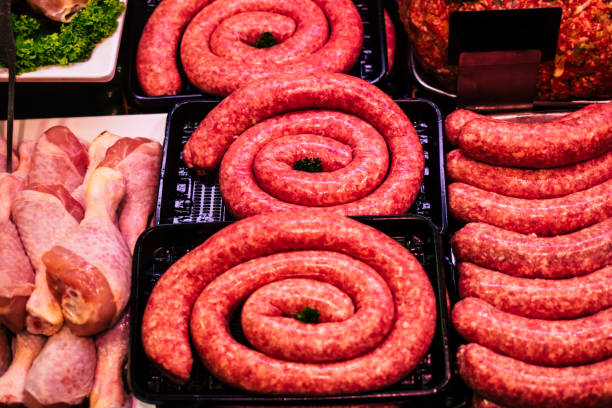 istock Raw round meat sausage in butchery store 867143380