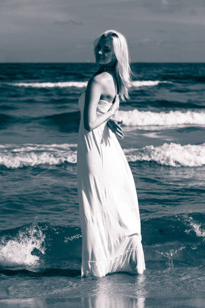 istock Beautiful woman on sunny beach. 867143418