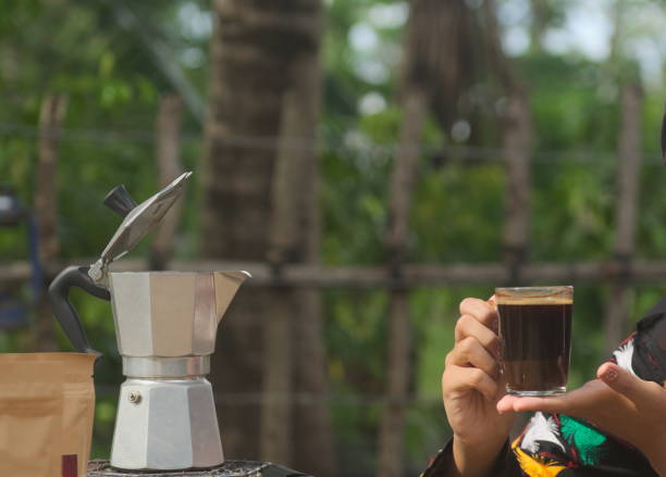 istock Holding Cup of Black Coffee 867144060