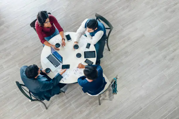 Overhead view of a business meeting in office space