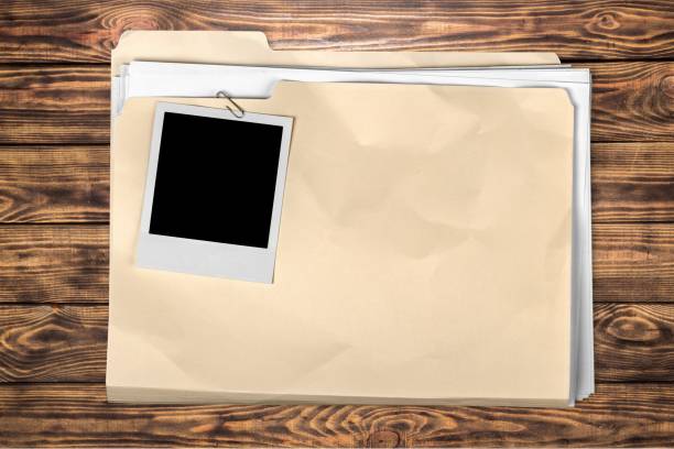 File. Yellow file folder on wooden background briefcase photos stock pictures, royalty-free photos & images