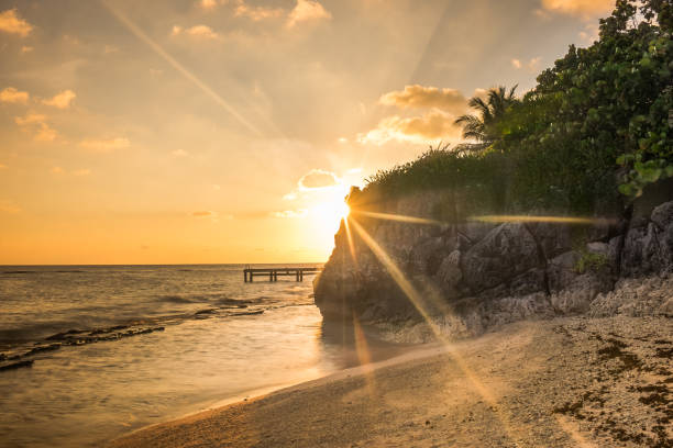 Spotts Beach Sunset Sunset on Spotts Beach by the Caribbean Sea, Grand Cayman cayman islands stock pictures, royalty-free photos & images