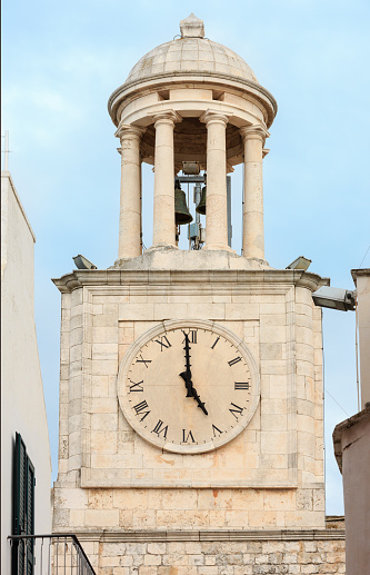 Bell tower in small medieval whitewashed town Locorotondo, Puglia (Apulia), Bari region, Italy