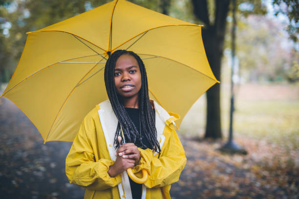 istock Young black woman in autumn walk through park 867169168