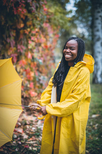 istock Young black woman in autumn walk through park 867171100