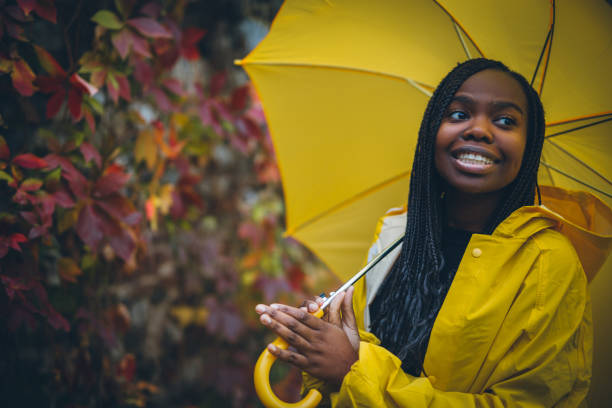 istock Young black woman in autumn walk through park 867171144