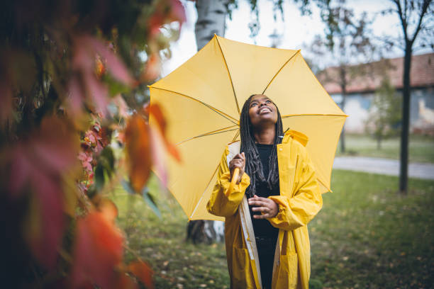 istock Young black woman in autumn walk through park 867171146
