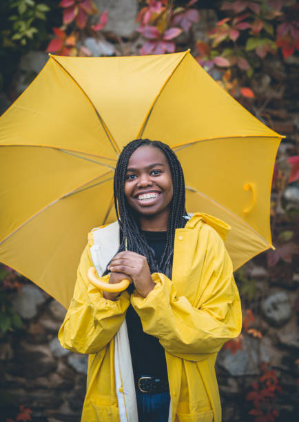 istock Young black woman in autumn walk through park 867171278