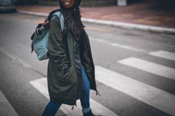 istock Woman crossing street 867171932