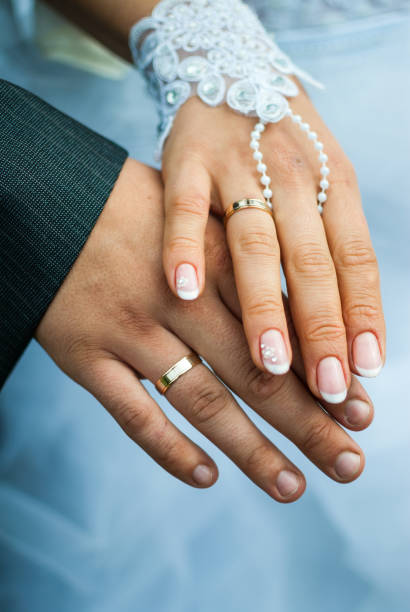 istock Happy bride and groom show off their rings 867172422